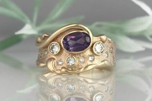 Recycled Diamonds and Recycled Gold make the sand-cast Amethyst Wave Ring.