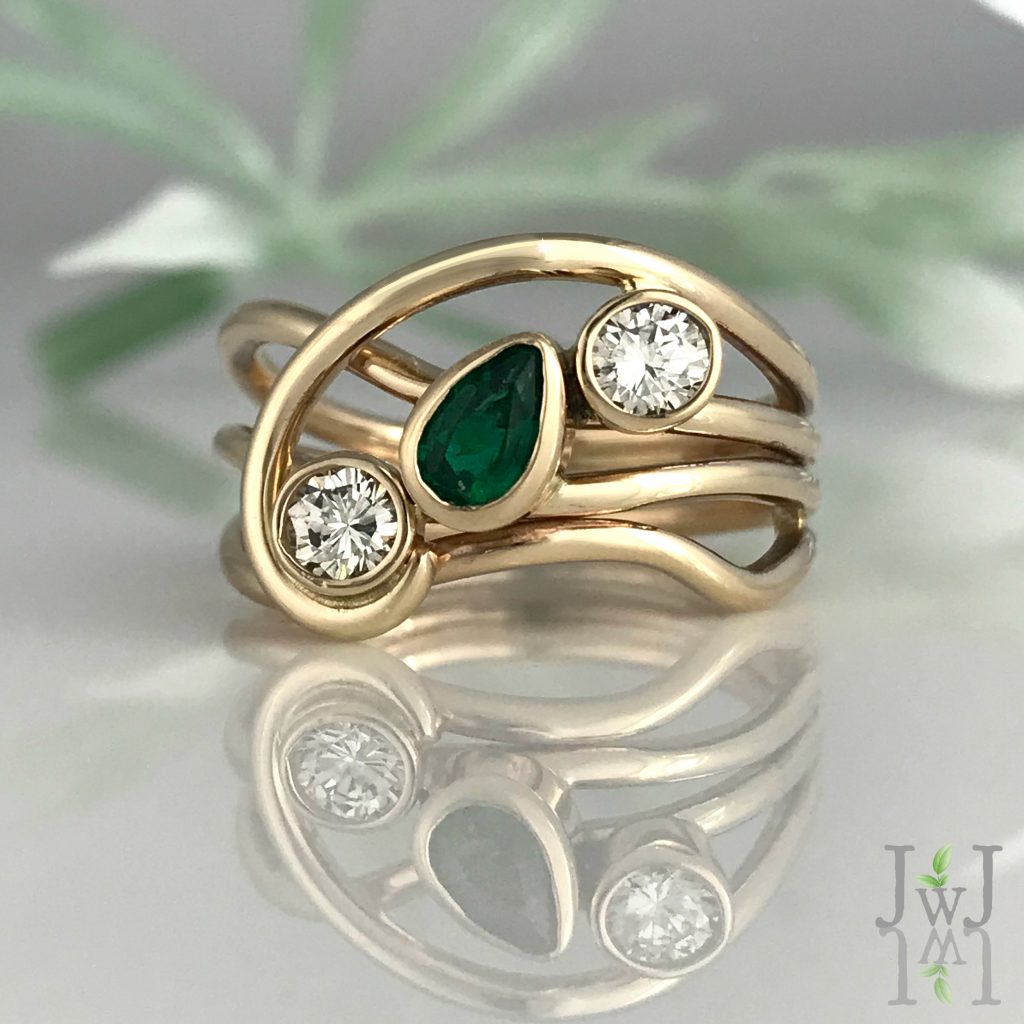 A Green Horizon Ring of recycled gold, recycled Diamonds and a beautiful Emerald.